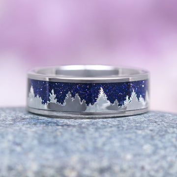 Starry Night & Trees Couples Ring Set featuring a polished band with a sparkling blue sandstone inlay depicting a silhouette of pine trees, crafted by Aquamarise for matching couples' rings and celestial-inspired jewelry.