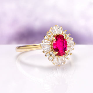 Victoria Natural Ruby Engagement Ring in 14K Solid Yellow Gold by Aquamarise Gold featuring a vivid oval ruby center framed by radiant baguette and round moissanite accents.