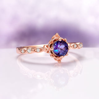 Vintage Alexandrite Fairytale Engagement Ring in 14K Rose Gold Vermeil by Aquamarise, featuring a round color-shifting alexandrite and delicate diamond accents in a vintage-inspired setting.