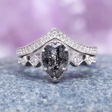 Teardrop Rutilated Quartz Engagement Ring Set- 14K White Gold featuring a pear-shaped rutilated quartz centerpiece surrounded by intricate diamond accents on a delicate white gold band, crafted by Aquamarise Gold.
