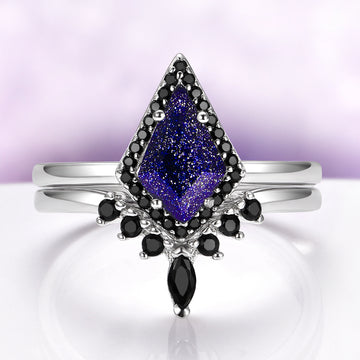 Starry Night & Black Onyx Engagement Ring Set in 14K White Gold by Aquamarise Gold, featuring a kite-cut celestial blue sandstone surrounded by black onyx accents on polished white gold bands.