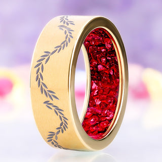 Angled view of the gold titanium laurel band showing the full crushed garnet sleeve and the wave of etched leaves