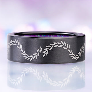 Front view of the brushed black titanium band showing the laser-etched laurel vine and the lavender opal inside