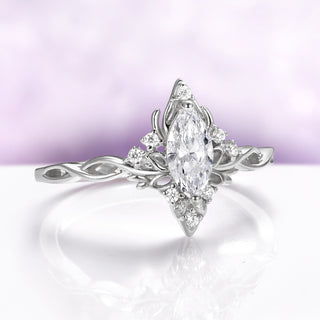 Butterfly-inspired marquise engagement ring in 14K white gold by Aquamarise Gold, side view showing lotus details
