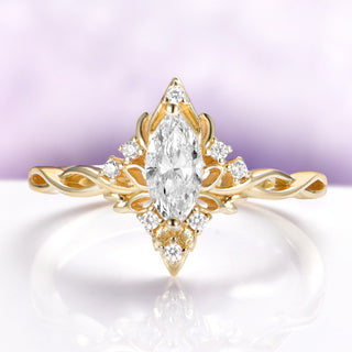 Marquise butterfly engagement ring in solid 14K yellow gold by Aquamarise Gold with sculpted wing details