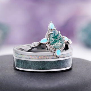 Moss Agate & Fire Opal Couple Ring Set by Aquamarise, the engagement ring resting on the matching inlay wedding band.