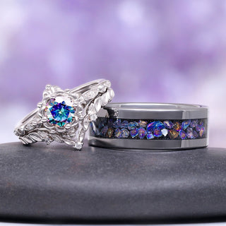 Two rings with gemstones on a dark surface and purple gradient background