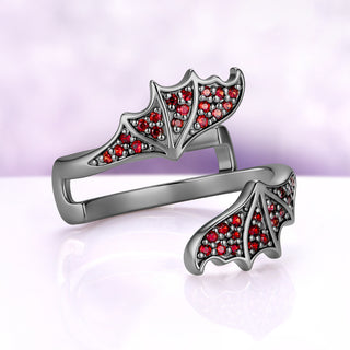 Angled view of the bat wing band alone, showing the ribbed wing membranes and natural garnet pavé
