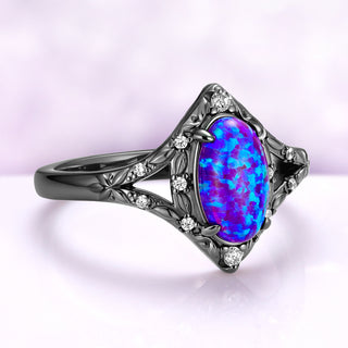 Angled view of the Nerida lavender opal ring, showing the split shank with engraved leaves and simulated diamond accents beside the oval cabochon