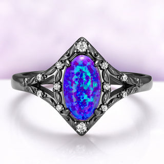 Nerida Lab-Grown Lavender Opal Engagement Ring in Black Ruthenium by Aquamarise, oval opal with violet and blue fire in a kite-shaped frame of engraved leaves