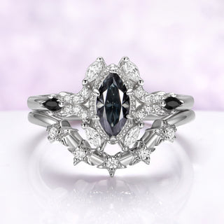Gray moissanite and black onyx bridal ring set in sterling silver, all three rings stacked