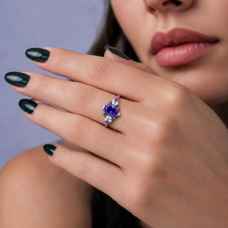 Noraleaf Lab-Grown Purple Sapphire Engagement Ring in Black Ruthenium by Aquamarise, worn on the hand to show the purple sapphire centre.