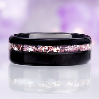 Front view of the polished black tungsten band showing the off-center crushed morganite channel and rounded dome profile