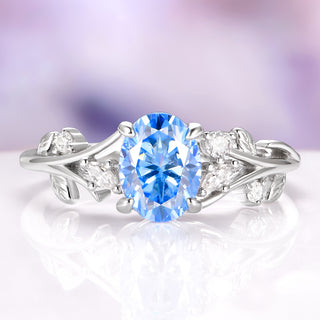 Silver ring with a blue gemstone on a white background