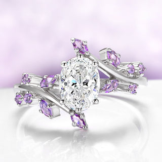 Silver ring with purple gemstones on a light purple background