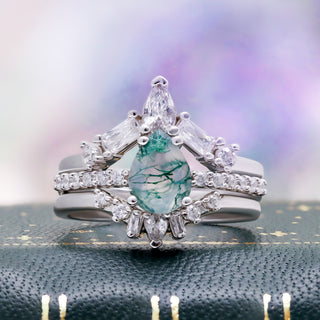 Pear Green Moss Agate Three-Piece Bridal Ring Set in Sterling Silver by Aquamarise, displayed on a dark gold-flecked jewelry tray.