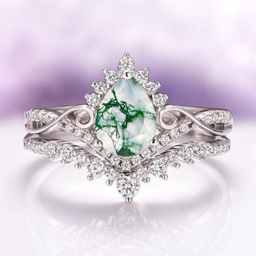 Faye Green Moss Agate Engagement Ring Set in Sterling Silver by Aquamarise featuring a pear-shaped green moss agate surrounded by sparkling silver and diamond accents.