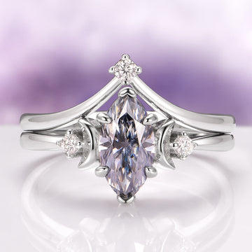 Gray Moissanite Crescent Moon Couples Ring Set by Aquamarise featuring a marquise-cut gray moissanite center stone accented by crescent moon motifs and small diamonds on polished silver bands, from Matching Couples' Rings and Moissanite Gemstone Jewelry collections.
