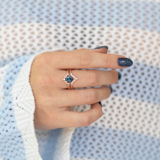 Lunette Teardrop Alexandrite Ring Set in 14K Rose Gold Vermeil by Aquamarise, featuring a pear-shaped alexandrite center and diamond accents on a styled hand with knit background