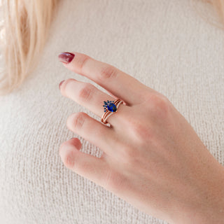 Dakota Teardrop Blue Sapphire Ring Set in 14K Rose Gold Vermeil by Aquamarise, featuring a pear-shaped sapphire with delicate accent stones on a rose gold vermeil band.