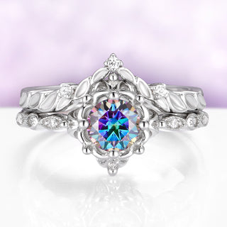 Silver ring with a colorful gemstone on a white background