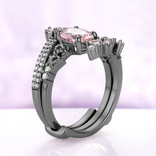 Side profile of the rose-sculpted center ring nested inside the two arms of the black ruthenium wrap band
