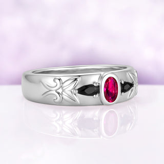 Angled view of the 6mm ruby and black onyx men's band showing the dome profile and carved leaf and scrollwork along the shoulder