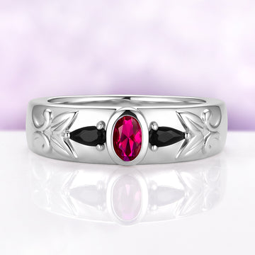 Men's 6mm sterling silver wedding band with a bezel-set oval lab-grown ruby between two black onyx pears and carved leaf shoulders