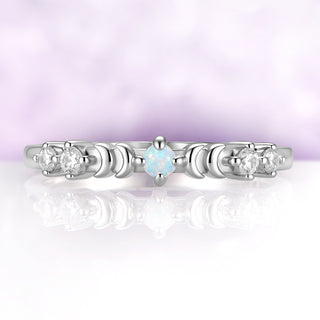 Selene Lab-Created White Fire Opal Crescent Moon Band in Sterling Silver by Aquamarise, a round white opal between two crescent moons with moissanite clusters