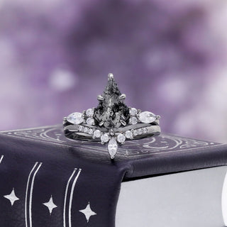 Skye Kite Galaxy Herkimer Diamond Ring Set in Black Ruthenium by Aquamarise, a kite-cut salt and pepper Herkimer diamond on a celestial-print backdrop.