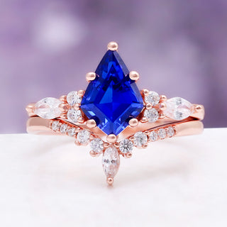 Skye Kite Orion Nebula & Cornflower Sapphire Ring Set in Rose Gold by Aquamarise, a kite-cut cornflower sapphire with marquise diamond accents.