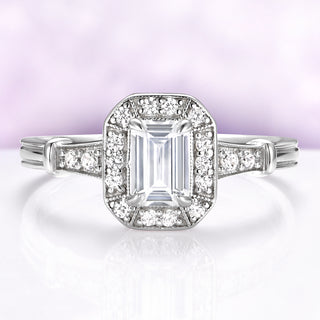 Vintage White Sapphire Ring in Sterling Silver by Aquamarise featuring an emerald-cut lab-grown white sapphire with a sparkling diamond halo on a sterling silver band for elegant engagement jewelry.