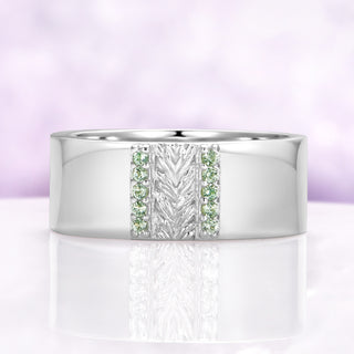 Mens 8mm sterling silver wedding band with a carved leaf panel and green tourmaline channels
