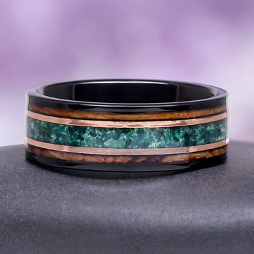 Hexagon Moss Agate & Whiskey Barrel Couples Rings Set featuring a black tungsten band with a green moss agate inlay bordered by whiskey barrel wood and rose gold accents by Aquamarise.