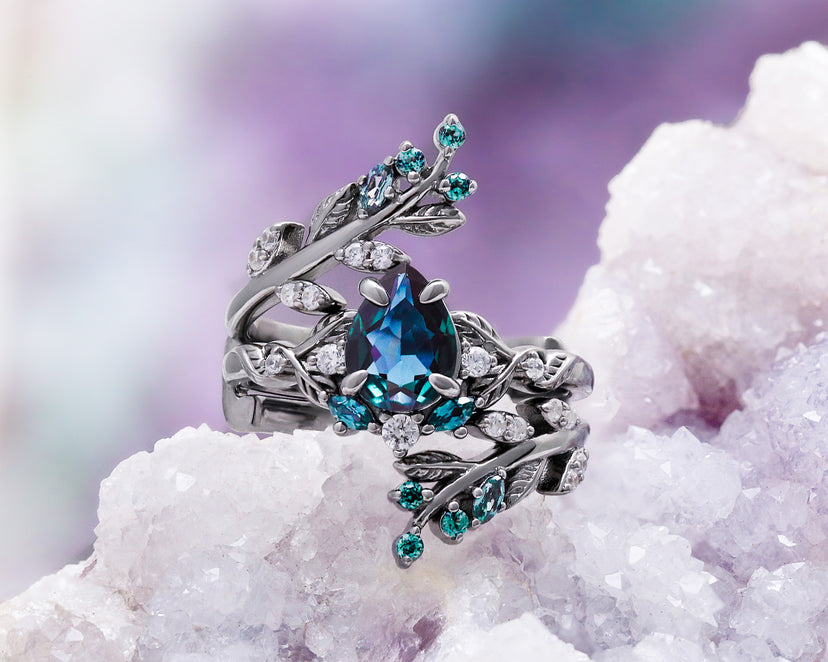 Wisteria alexandrite fairy leaf ring in black ruthenium on a geode