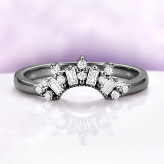 Art Deco Pear Blue Sapphire Ring Set in Black Ruthenium by Aquamarise, featuring black ruthenium band with baguette and round white diamond accents in an Art Deco-inspired design.