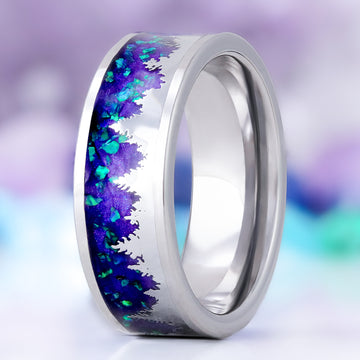 Borealis forest men's wedding band in tungsten carbide, 8mm, standing view showing the tree line against the purple inlay with teal opal flecks