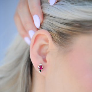 Model wearing the Carmilla lab-grown ruby and black onyx stud earring in sterling silver