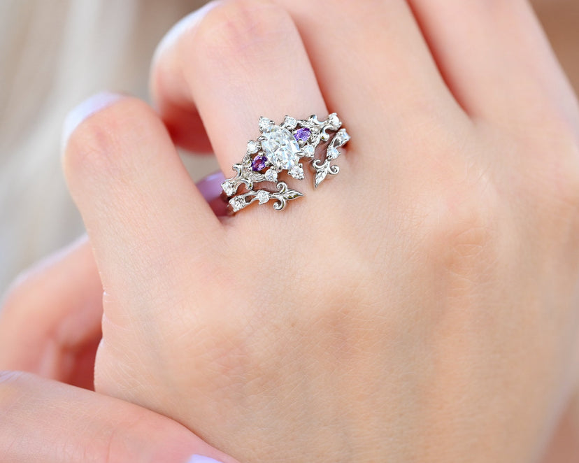 Carmilla Oval Moissanite and Amethyst engagement ring with the Leaf and Vine ring enhancer in sterling silver worn on the hand