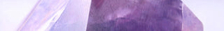 Close-up of a purple crystal with a clear background