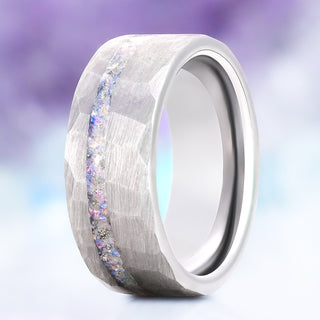 Crushed moonstone men's wedding band in hammered silver tungsten carbide, 8mm, standing view showing the iridescent moonstone channel and faceted finish