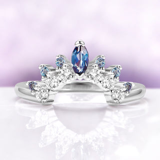 Alexandrite Curved Wedding Band in Sterling Silver by Aquamarise, featuring a marquise-cut alexandrite and round accent stones on a polished curved sterling silver band.