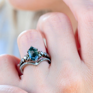 Elara hexagon green moss agate and crescent moon ring set in black ruthenium worn on a model's hand