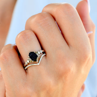 Elara Starry Night crescent moon engagement ring set in sterling silver worn on a model's hand