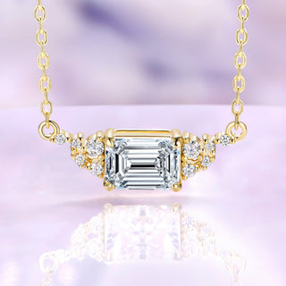 Emerald cut moissanite necklace in 14K yellow gold vermeil, 6x8mm center stone set east-west with round moissanite accents