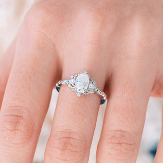 Diamond ring on a finger with a blurred background