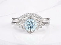Flower and leaf engagement ring by Aquamarise with sculpted petal detailing