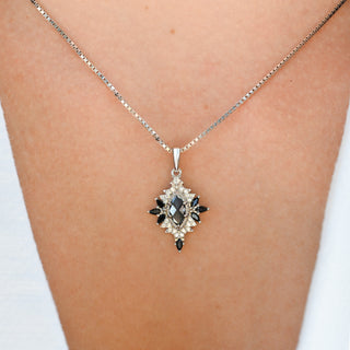 Model wearing the Nightbriar gray moissanite and black onyx pendant necklace in sterling silver