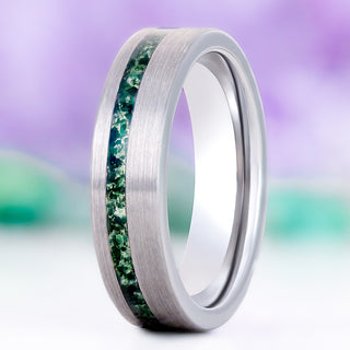 Green Moss Agate men's wedding band in brushed silver tungsten, 6mm, standing upright with an off-set channel of mossy green agate