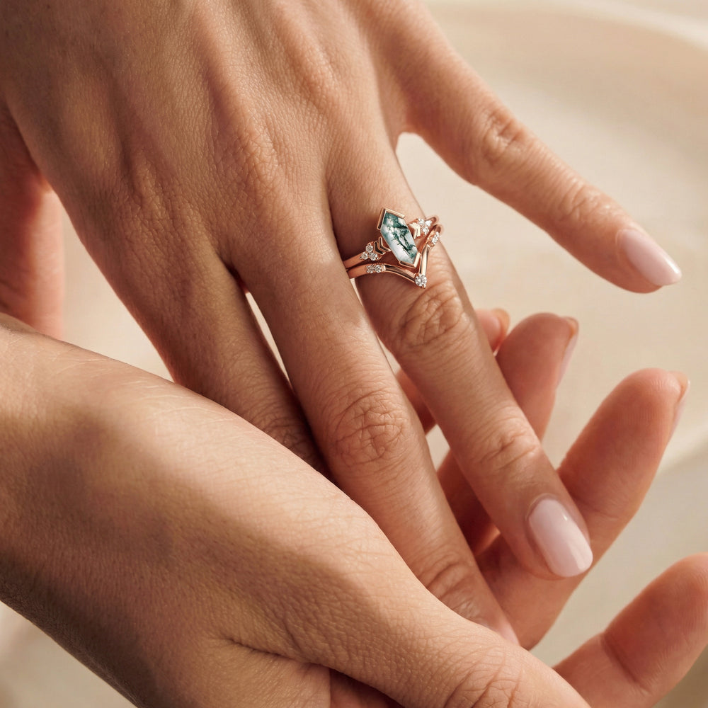 Moss agate engagement ring by Aquamarise on a hand